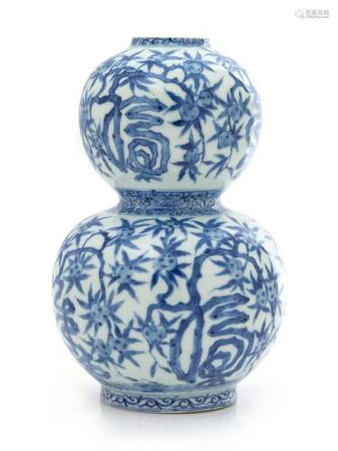 A Chinese Blue and White Gourd-Form Porcelain Vase