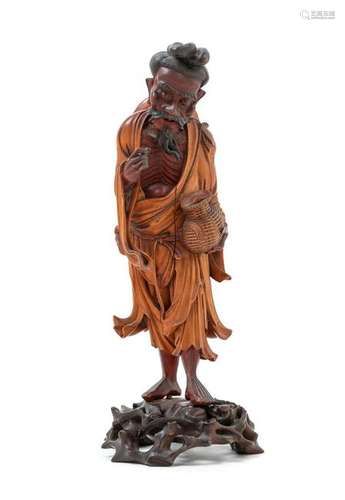 A Japanese Carved Wood Figure of a Fisherman Height 10