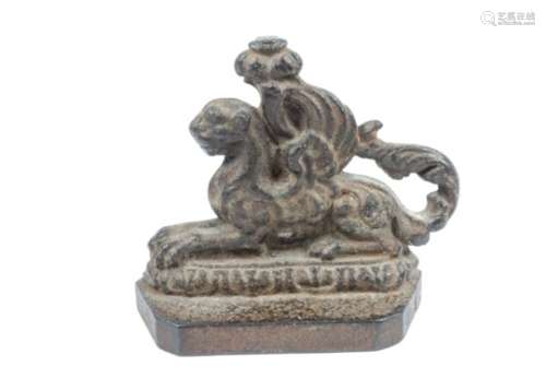 A Victorian cast iron doorstop, modelled as a winged lion, height 17 cm
