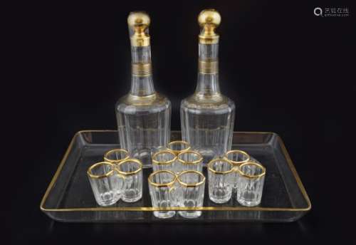 PAIR OF CRYSTAL AND PARCEL GILT DECANTERS