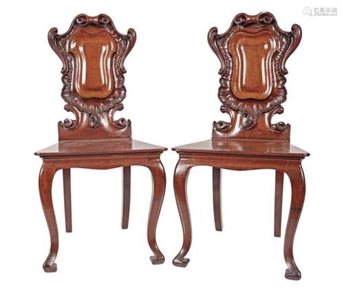 PAIR OF ARMORIAL BACK MAHOGANY HALL CHAIRS