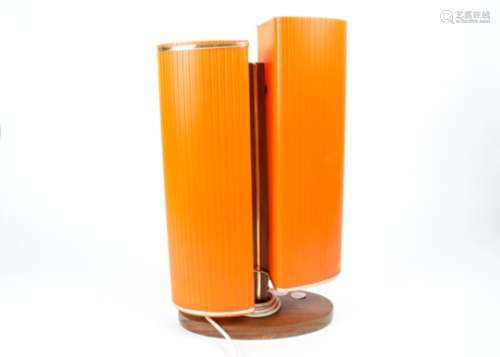 A mid Century retro table lamp, with textured corrugated effect orange shades with gold trimming,