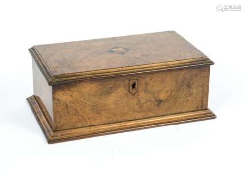An Edwardian walnut box, rectangular in shape with inlaid decoration on the lid and around the