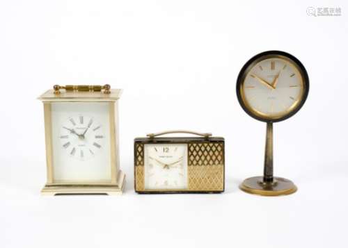 Two timepieces or 'carriage clocks', designed in the form of a radio with gilt and black lacquer