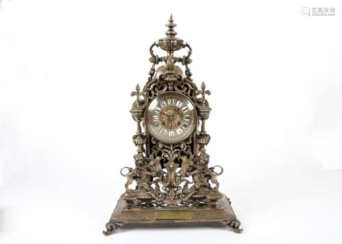 An Edwardian silver plated Rococo style mantle clock, white enamel and moulded silver plated dial