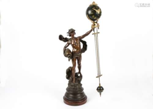 A 19th Century French spelter figural clock, designed as a man standing upon a wave, holding a jug