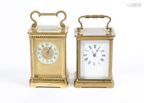 Two timepieces or 'carriage clocks', both with brass cases and glazed sides, one with Roman numerals