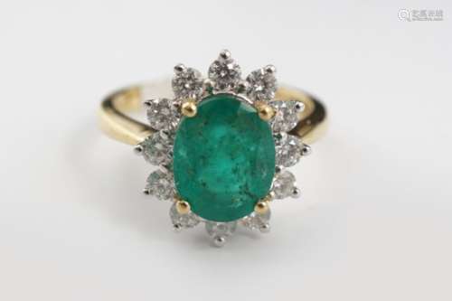 18 CARET GOLD EMERALD AND DIAMOND RING