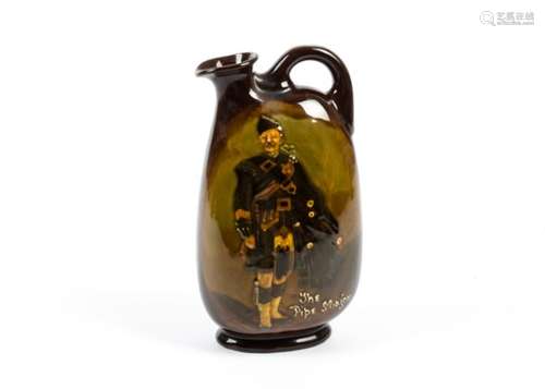 Attributed to Charles Noke (1858-1941) for Royal Doulton whisky flask, The Piper Major', for Dewars,