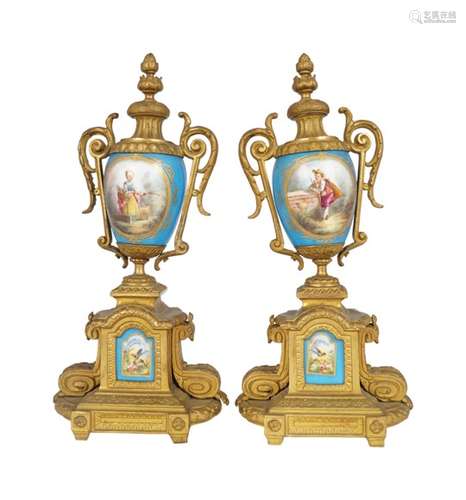 PAIR OF GILT METAL AND SEVRES PORCELAIN URNS