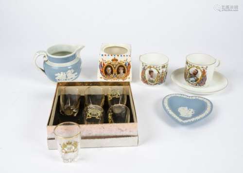 A collection of British commemorative ware, including mugs, glasses, plant holders, plates, dishes