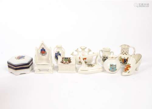 A collection of crested china wares, to include a cat for Llandudno, throne for Clacton on Sea and