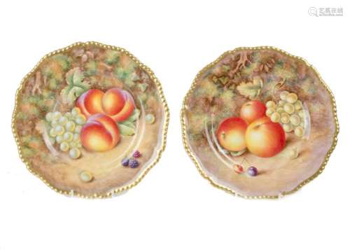 Two Royal Worcester cabinet plates, with shaped gilt borders and hand painted with fruit, one signed