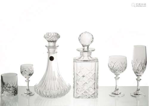 A quantity of crystal glasses and decanters, varying shapes and sizes, decanters height 25 cm (30+)