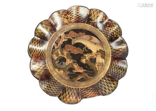 A Japanese Meiji period tortoiseshell dish, with lacquer decoration of an eagle looking upon