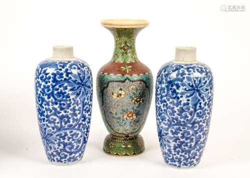 A pair of Chinese export vases, blue and white glaze with flowers and scrolling motifs, marks to the