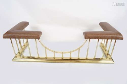 LARGE BRASS AND HIDE UPHOLSTERED CLUB FENDER