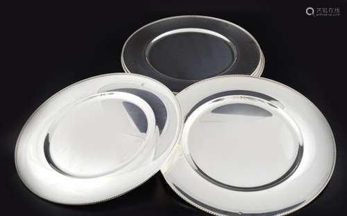 SET OF SEVEN SILVER PLATED SOUS PLATS