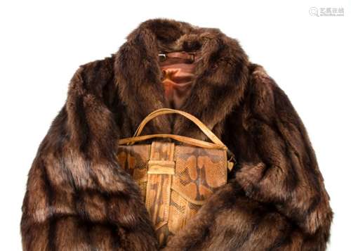 A lady's brown fur coat with brown silk lining, width (shoulder to shoulder) 50 cm, length 105 cm, a