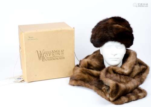 A lady's brown fur hat, together with a fur shawl with brown silk lining, length 142cm (2)