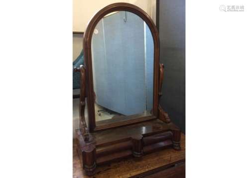 A William IV mahogany dressing table mirror, the arched swing mirror above a two drawer base, raised