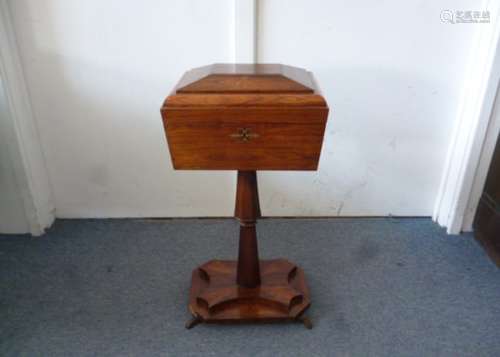 A Regency Rosewood Teapoy, with brass inlay, lid opens to reveal fitted interior