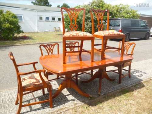 A contemporary yew wood dining suite, with twin pedestal table, on tripartite bulbous column