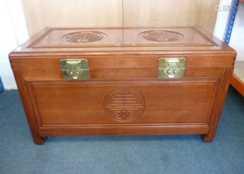 A Chinese camphor wood trunk, the moulded oblong rising top with decoration of two roundels over