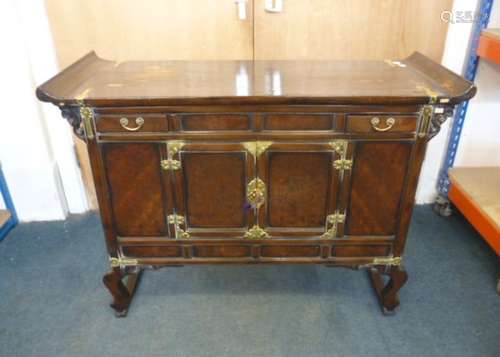 A Chinese fruitwood and pine dwarf cabinet, the oblong top with slightly upswept ends, over a pair