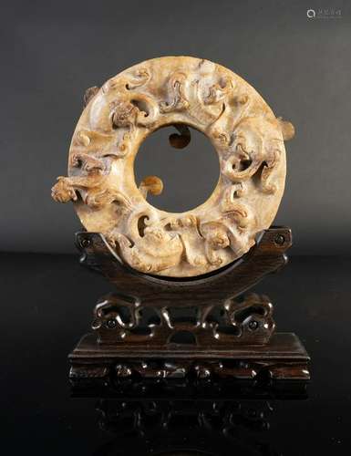 Arte Cinese  A pi white jade disc carved with tigers