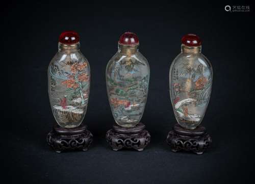 Arte Cinese  Three reverse painted glass snuff bottles