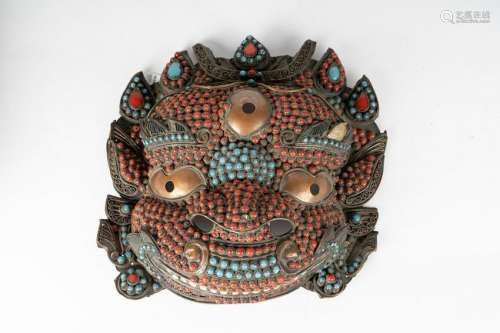 Arte Himalayana  A coral and turquoise incrusted mask