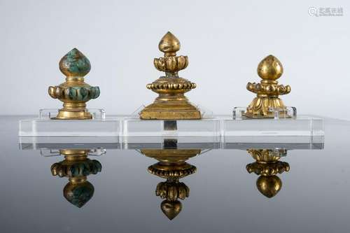 Arte Himalayana  Three gilded copper Stupa tipsTibet,