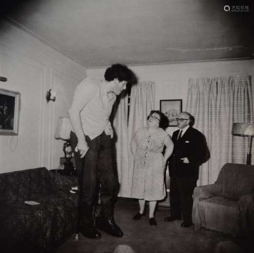 Diane Arbus -  Jewish Giant At Home With Parents, Bronx