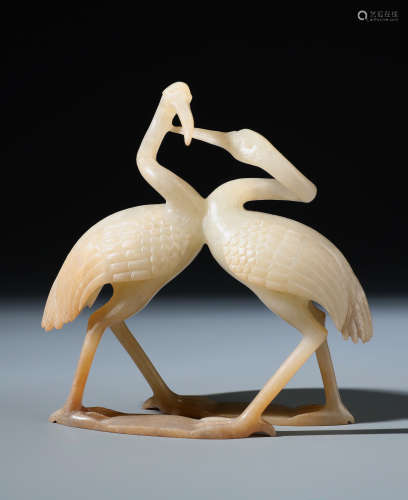 A  Chinese White and Russet Jade Carving of Twin Cranes