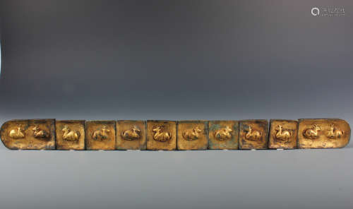 A Set of Eight Chinese Gilt-Bronze Belt Buckles