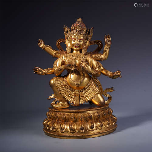 A Chinese Gilt Bronze Figure of Multi-armed Guardian