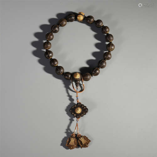 A Chinese Gold Decorated Alosewood Carved Rosary Bracelet