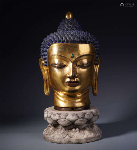 A Chinese Gilt Bronze Buddha Head and Stone Carved Lotus Base