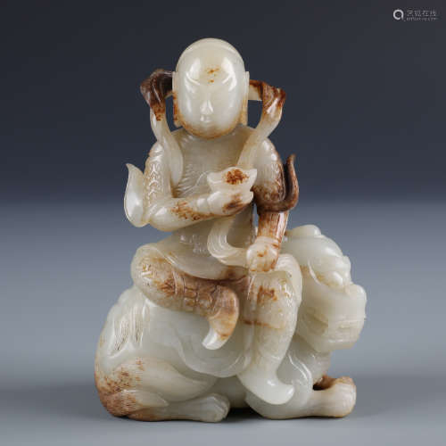 A Fine Chinese Carved White Jade Deity