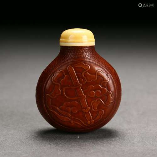A Chinese Carved Gourd Snuff Bottle