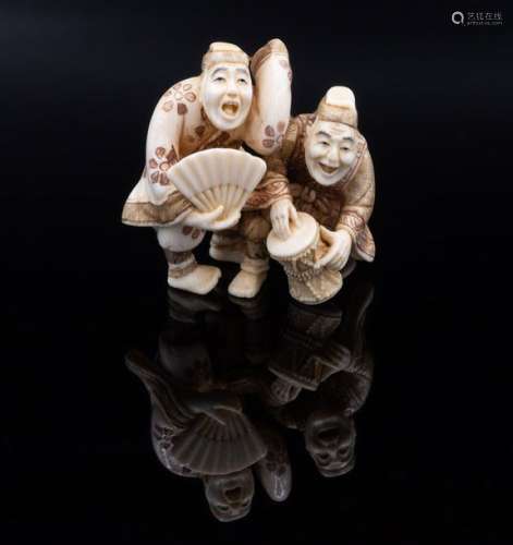 A Fine Carved Ivory Netsuke of a Pair of Musicians…