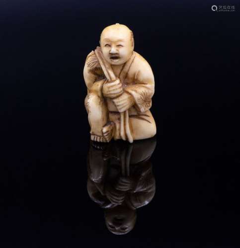A Carved Ivory Netsuke of a Fisherman, Edo Period …