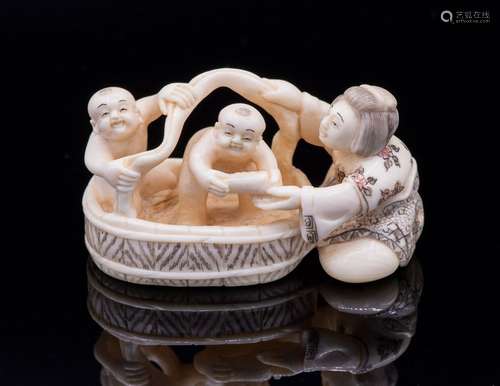 A Large Carved Ivory Netsuke of a Mother Bathing h…