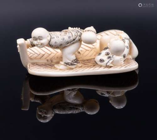 A Carved Ivory Netsuke of a Pair Saling on a Raft,…