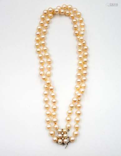 A Fine Two Row Pearl and Diamond Necklace