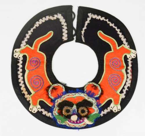 An early 20th century Chinese boy's tiger collar for protection, embroidered and applique work and