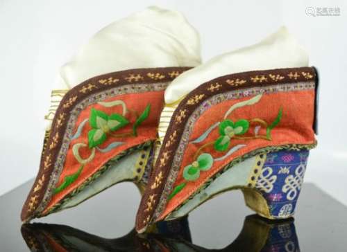 A pair of Chinese bound feet shoes or 'lotus shoes', late Qing Dynasty, circa 1900, hand embroidered