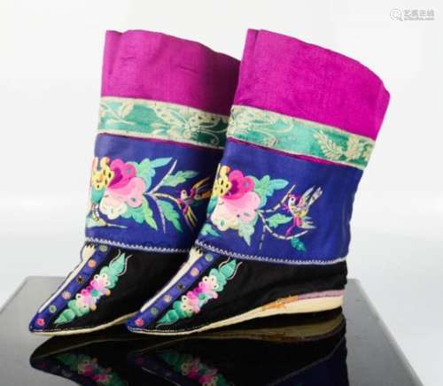 A pair of Chinese lotus shoes with ankle wrappers, in cerise pink, blue and black silk,