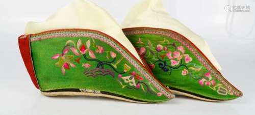 A pair of Chinese lotus shoes, circa 1920, green silk embroidered with dragon, butterfly and